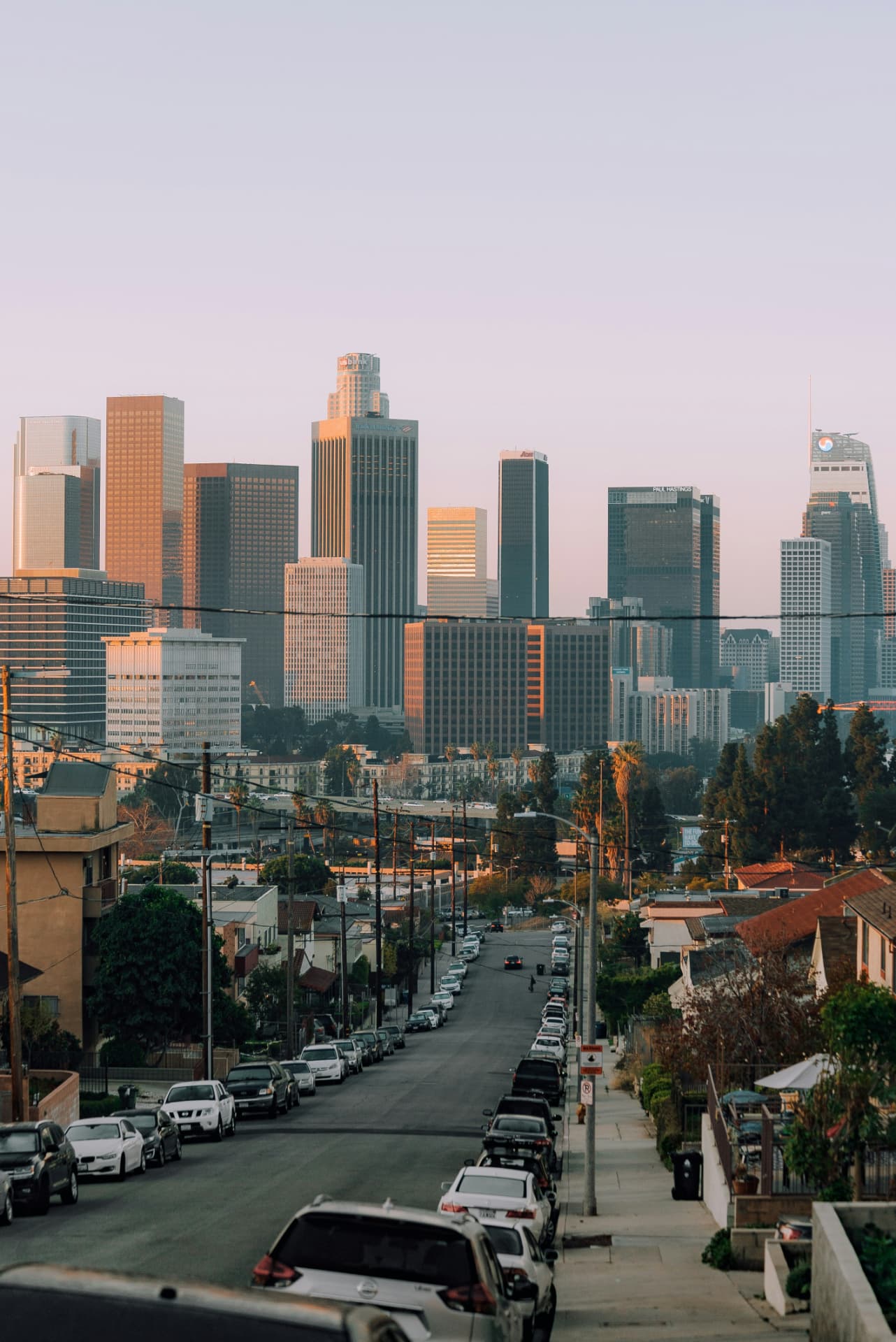 Executive sedan on a Downtown Los Angeles street with the skyline behind it