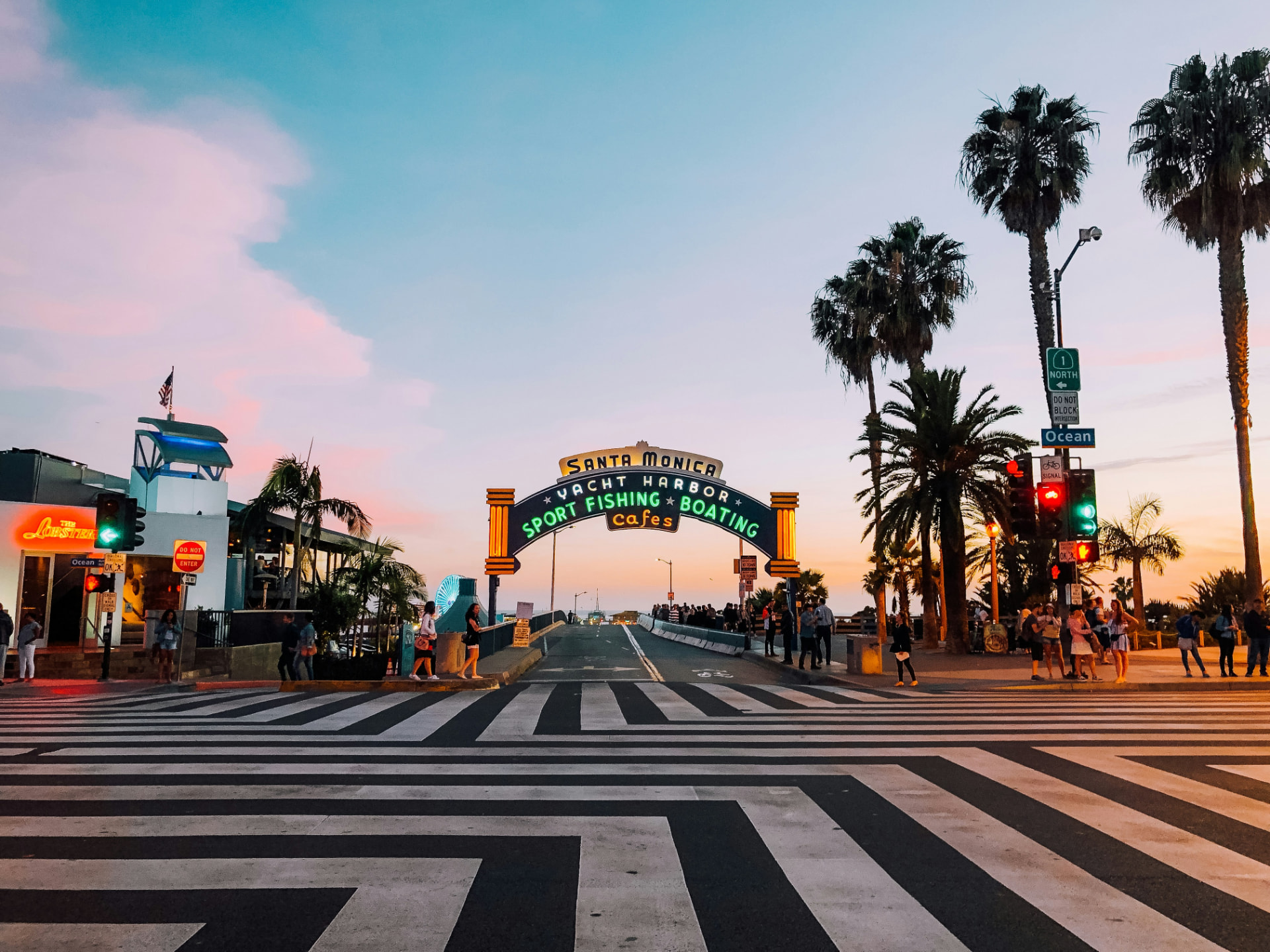 Santa Monica Pier entrance at dusk for professional chauffeur service