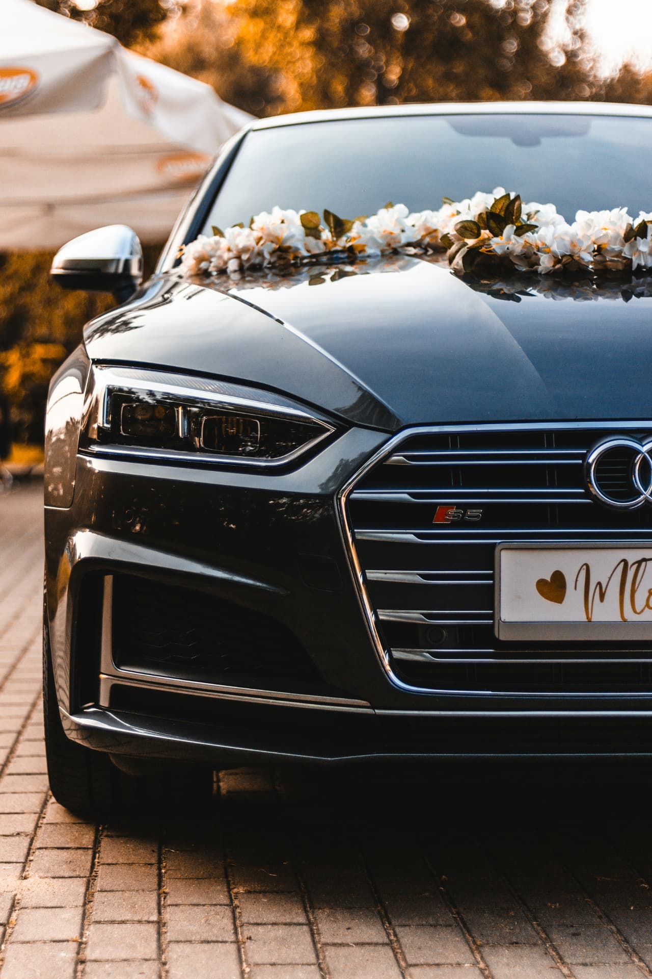 Flower-decorated luxury sedan for wedding car service in Los Angeles