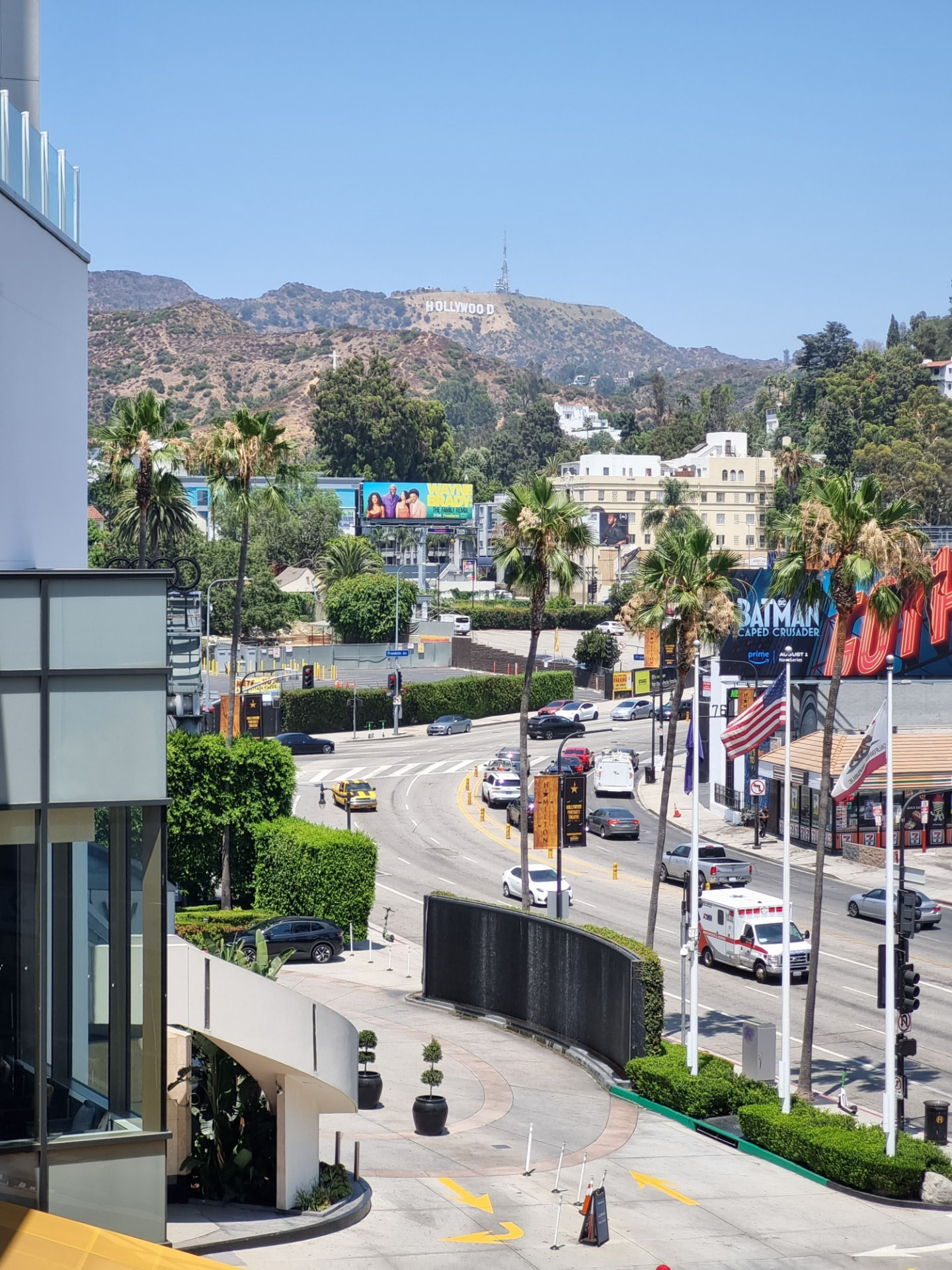 Hollywood sign above a busy Los Angeles boulevard near Studio City