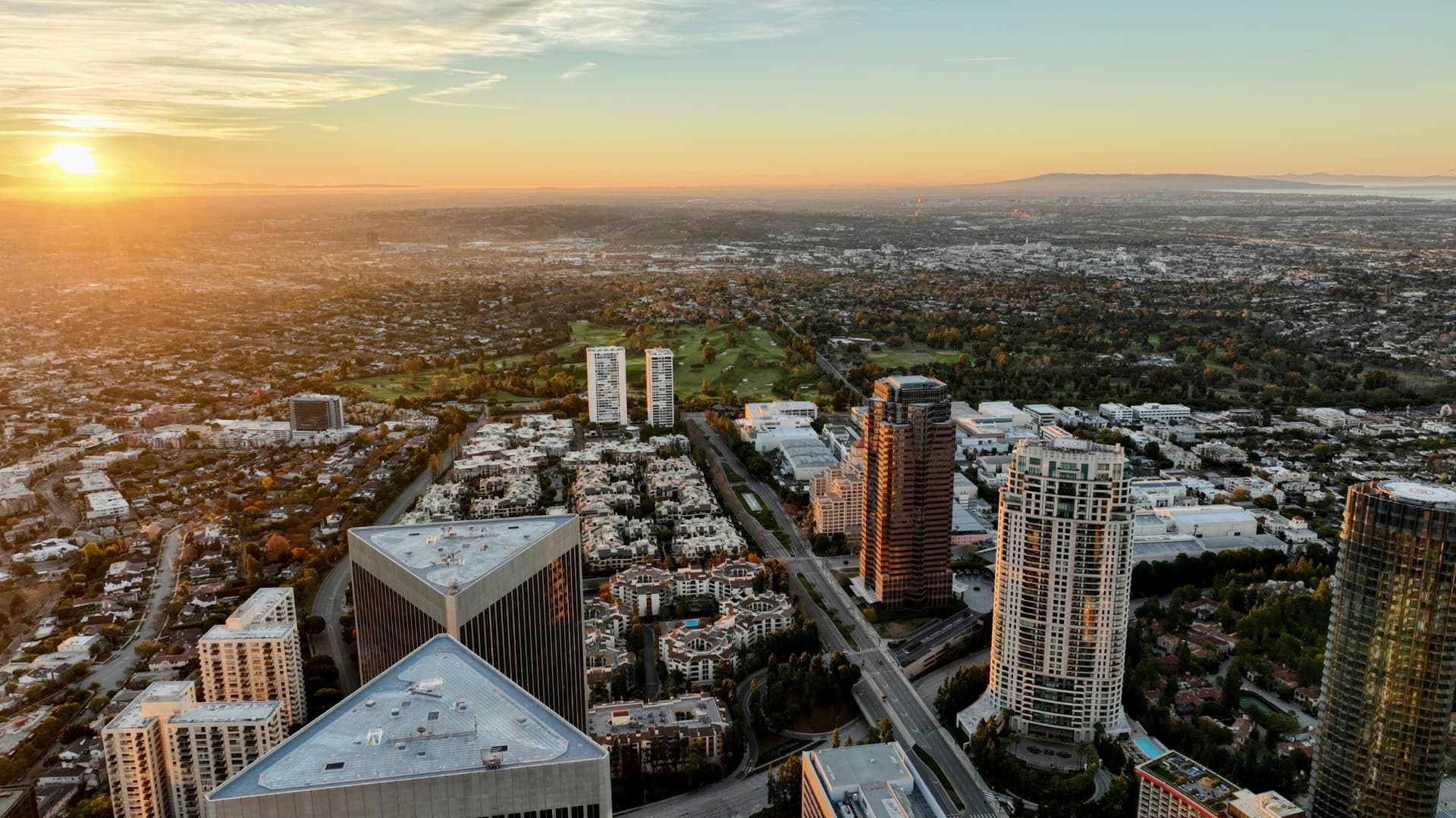 Aerial sunset view over Century City towers and neighborhoods