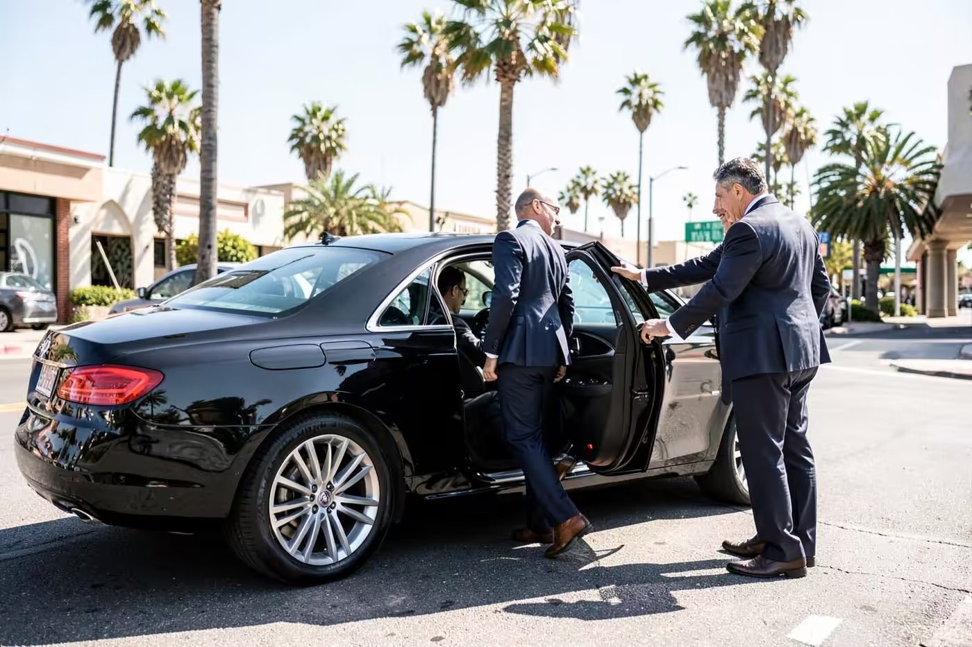 iRide360 chauffeur opening the door for a passenger arriving from Hollywood Burbank Airport