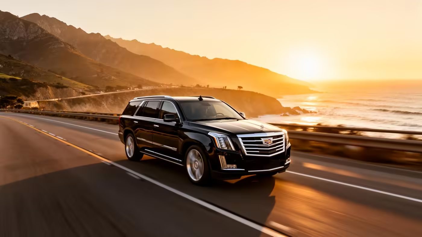 Black luxury SUV on a coastal road near Santa Monica